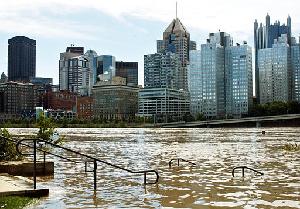 The Pittsburgh skyline is seen Saturday above the Allegheny River, which overflowed its banks due to the heavy rains from the remnants of Hurricane Ivan.